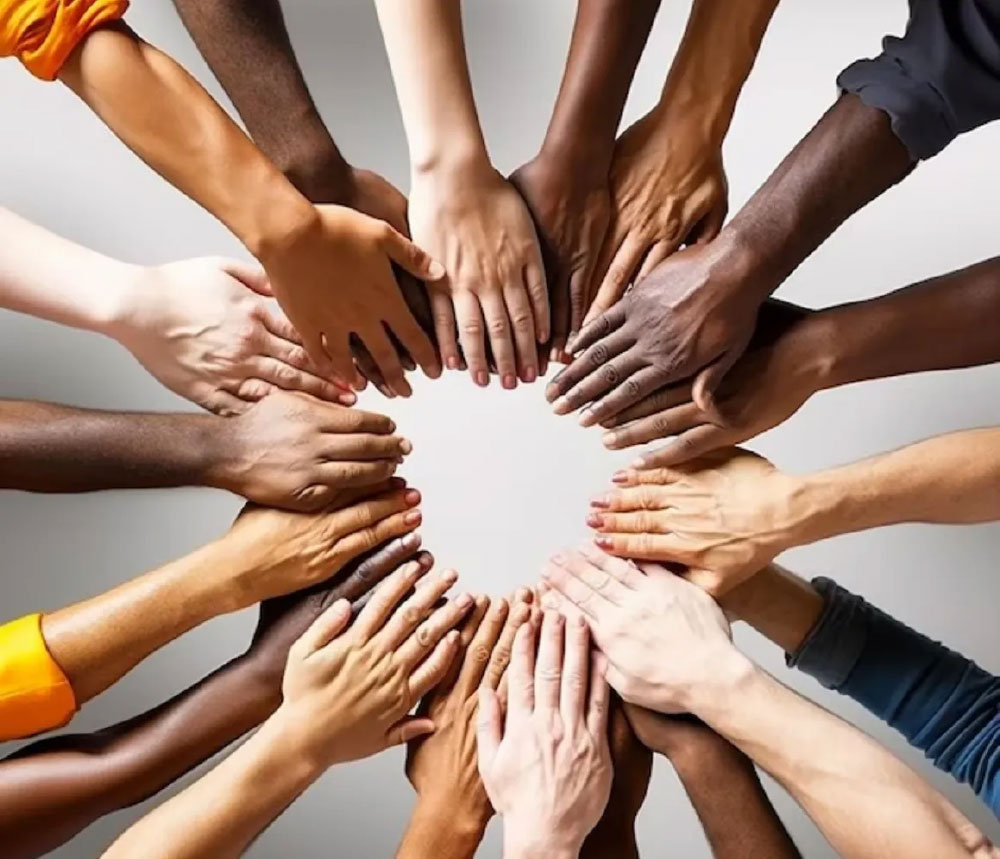 Circle of multi-racial hands