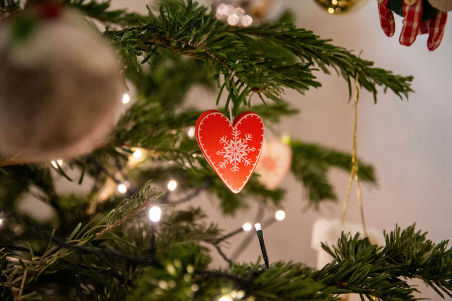 heart-shaped ornament hanging from a christmas tree