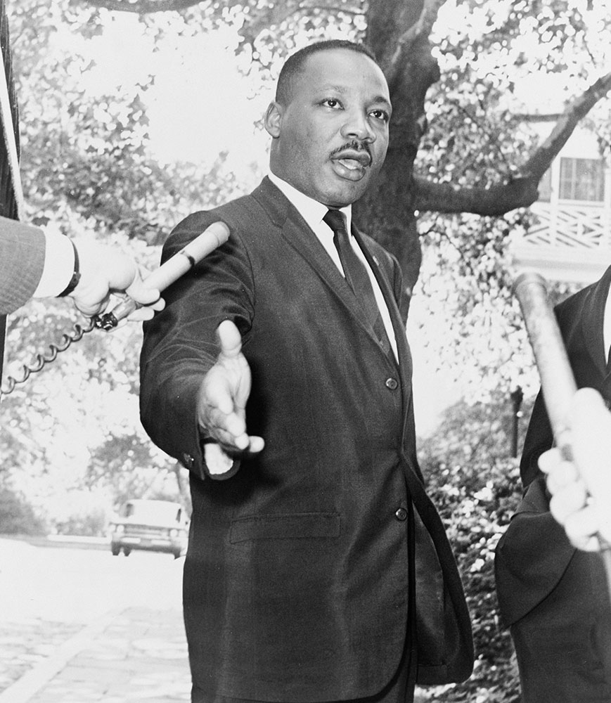 black & white photo of Dr. Martin Luther King, Jr. being interviewed